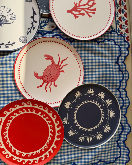 decorative plates scattered on a patterned background