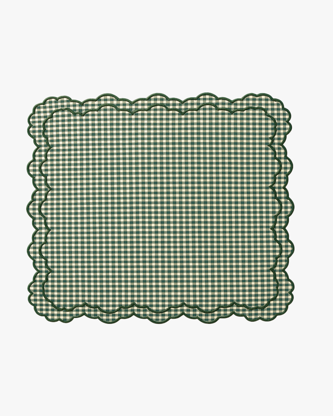 Green checkered placemat with scalloped edge on a white background