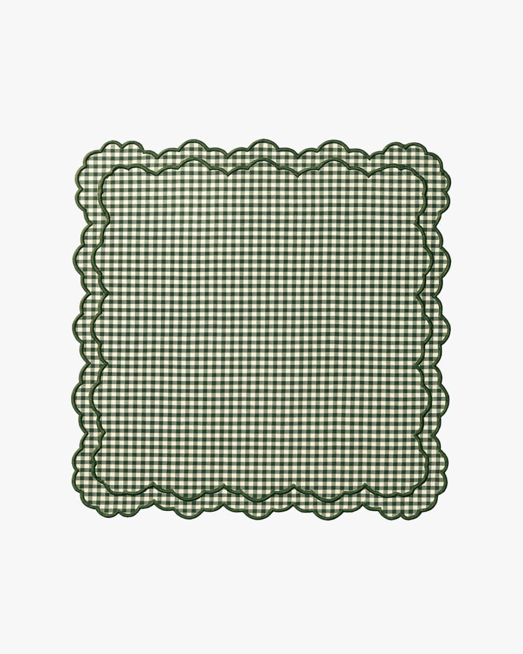 Green checkered napkin with scalloped edge on a white background