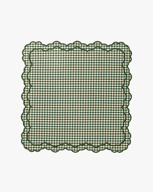 Green checkered napkin with scalloped edge on a white background