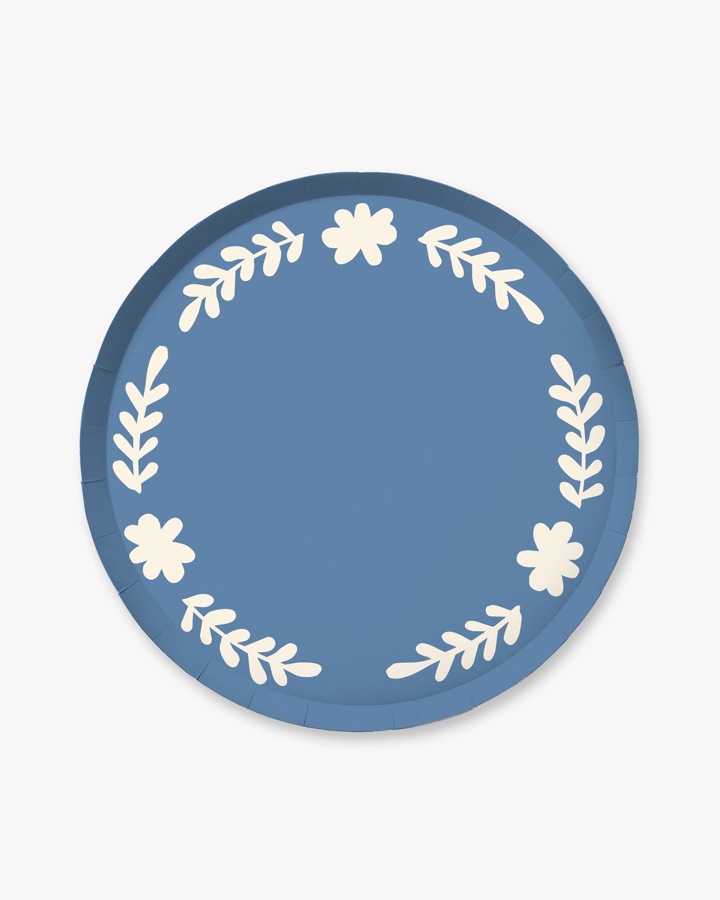 Blue paper plate with white floral and leaf patterns