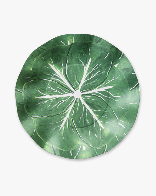 Green leafy patterned plate on a white background