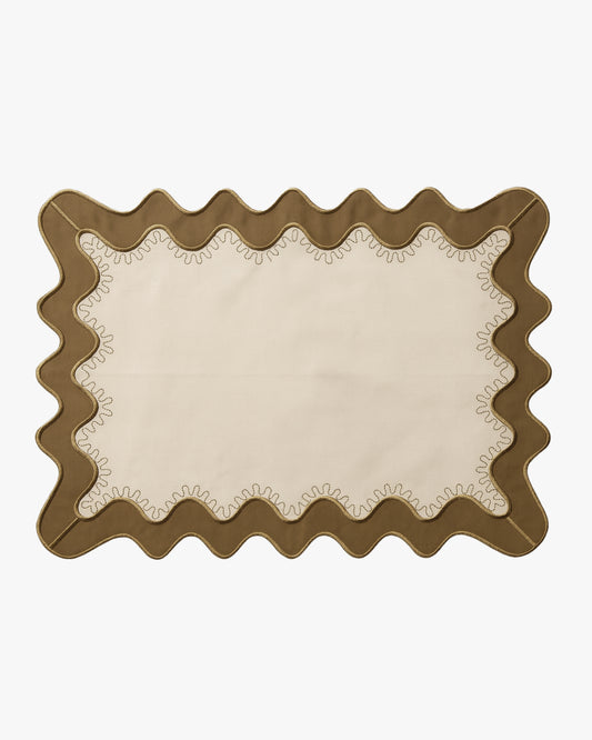 Beige placemat with an olive green scalloped edge