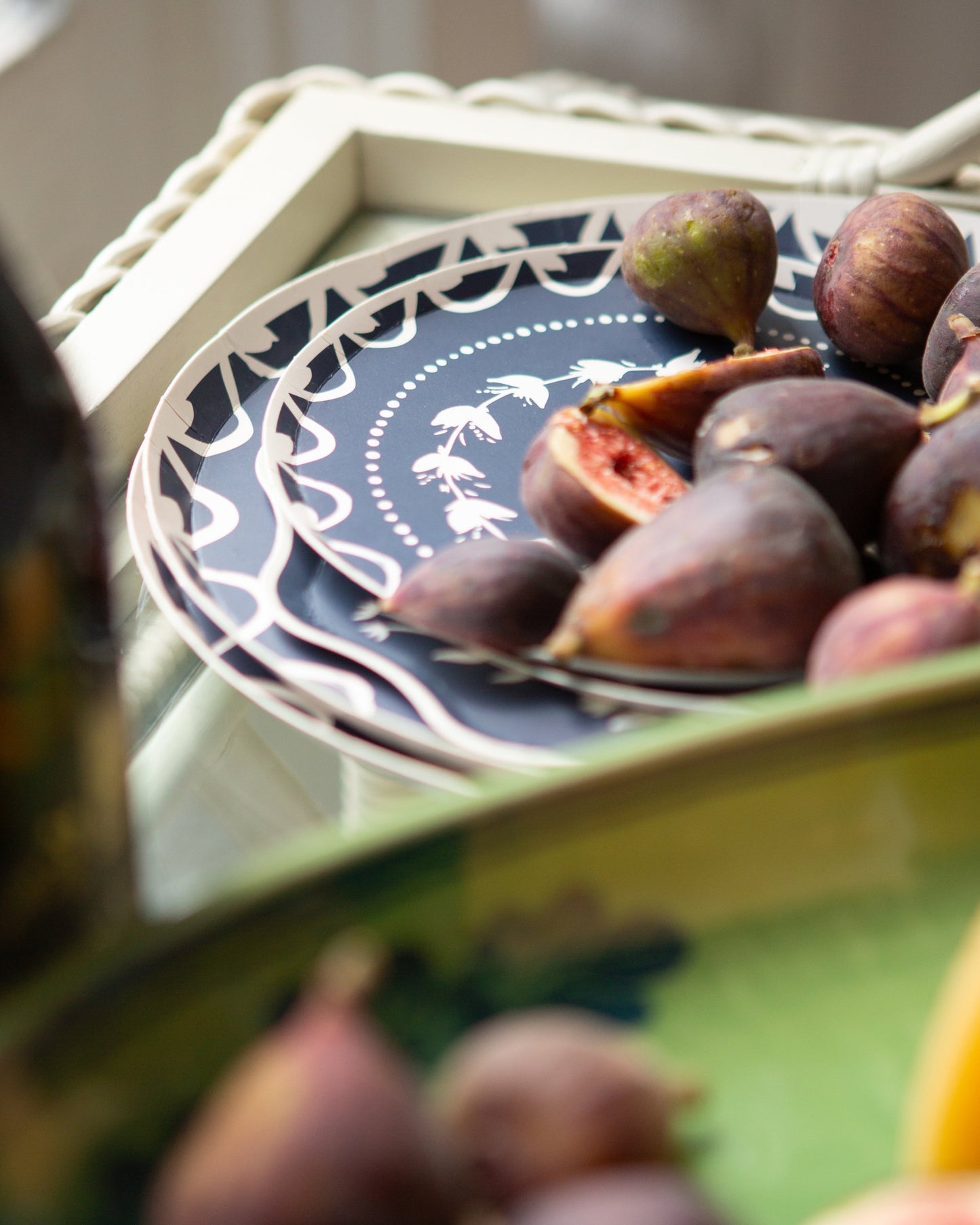 Figs on a decorative plate with a blurred background