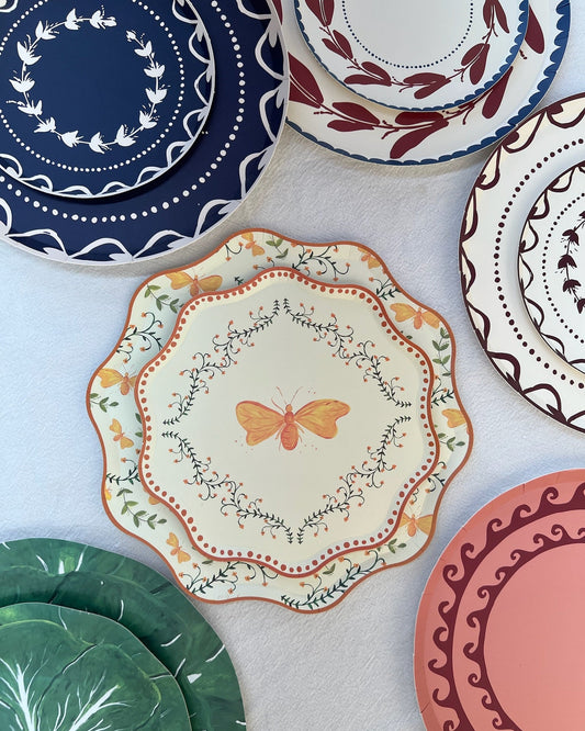 Collection of decorative plates with various patterns on a light background