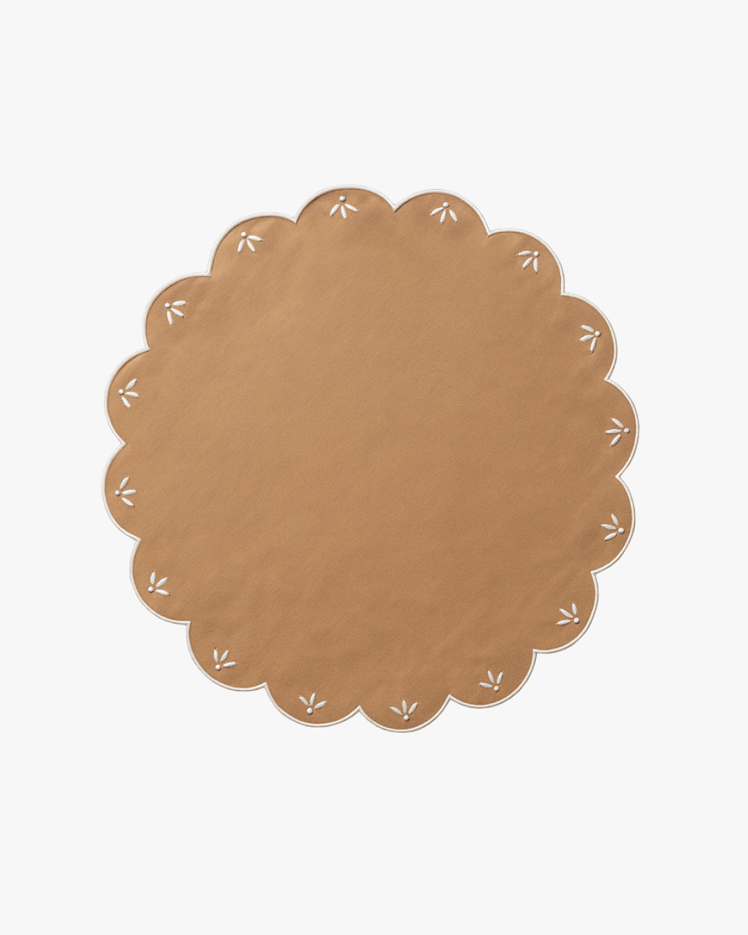 Round brown placemat with white floral patterns on a white background