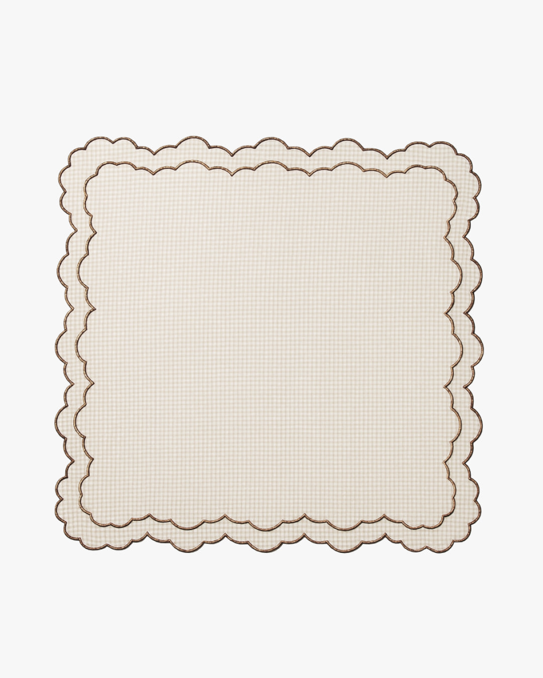 Beige checkered scalloped placemat on a white background