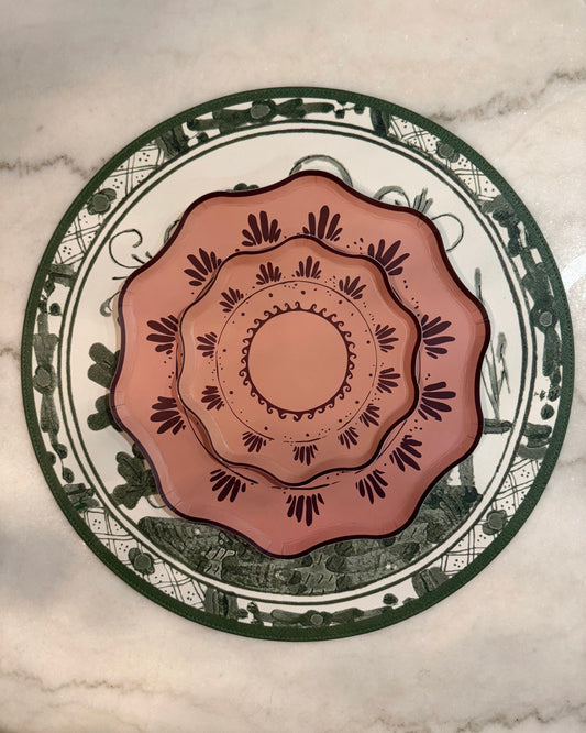 Decorative plate with intricate design on a marble surface