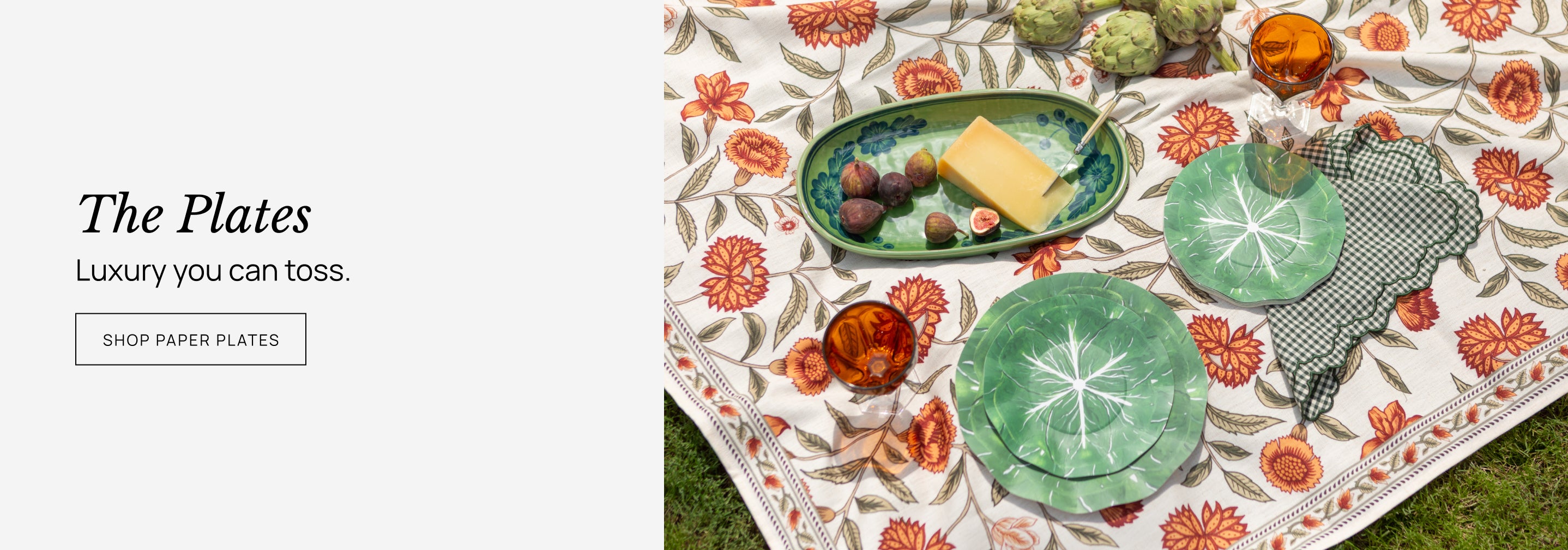 Decorative paper plates with food on a floral-patterned surface, promoting 'The Plates' category of the website