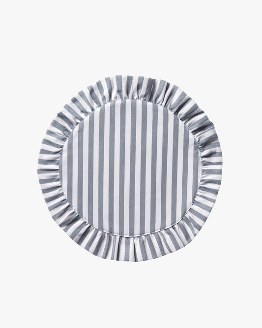 Round blue and white striped linen placemat with ruffled edge on a white background