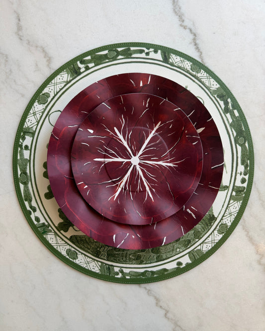 Decorative cabbage inspired paper plate set on a marble background