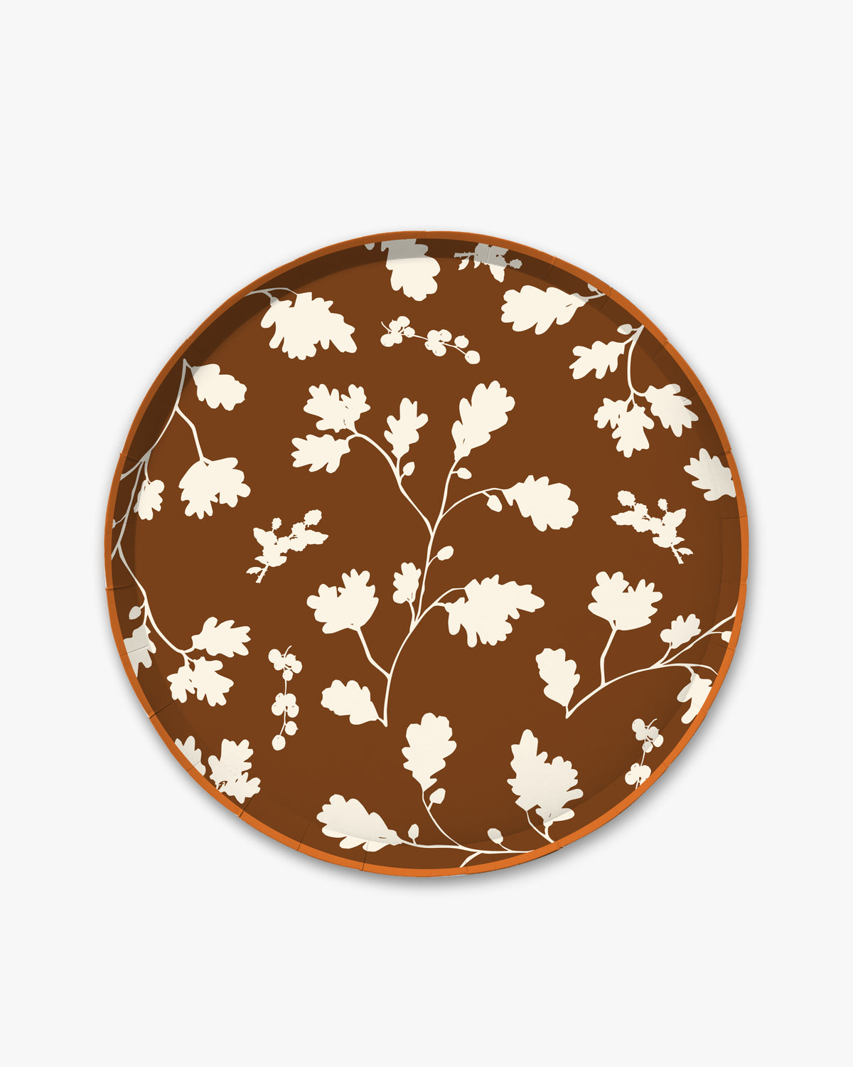 Brown paper plate with white silhouette pattern of fall leaves.
