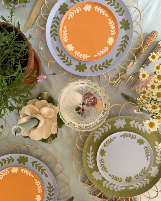 Decorative plates with floral patterns on a table setting.