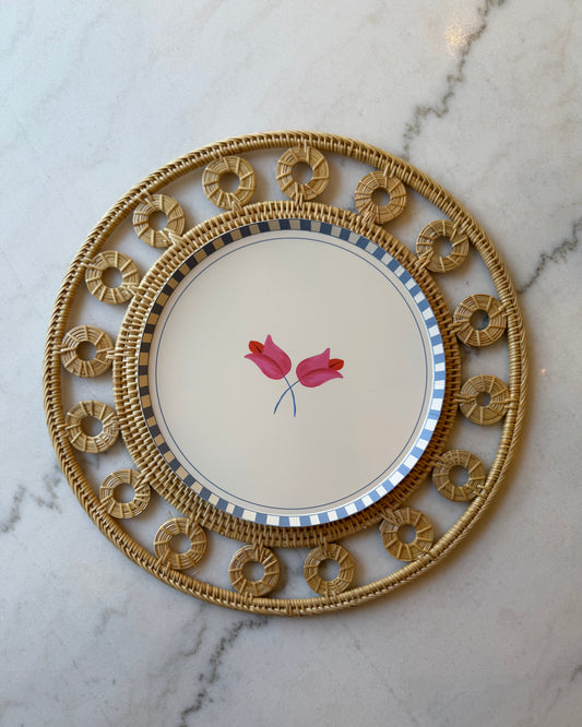 Decorative plate with floral design on a marble surface