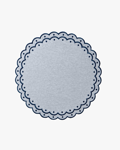 Blue placemat with dark blue embroidery