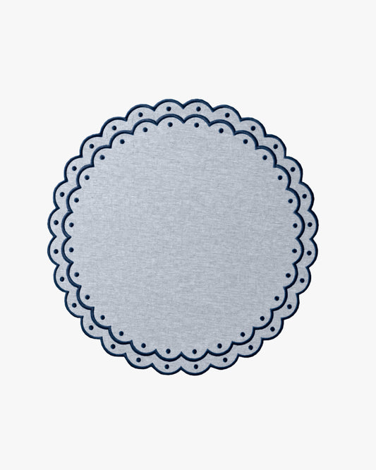 Blue placemat with dark blue embroidery