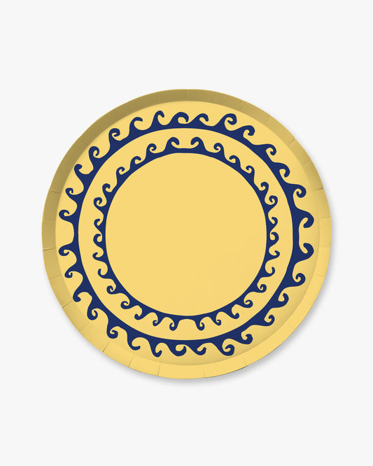 Round yellow plate with blue decorative pattern on a white background