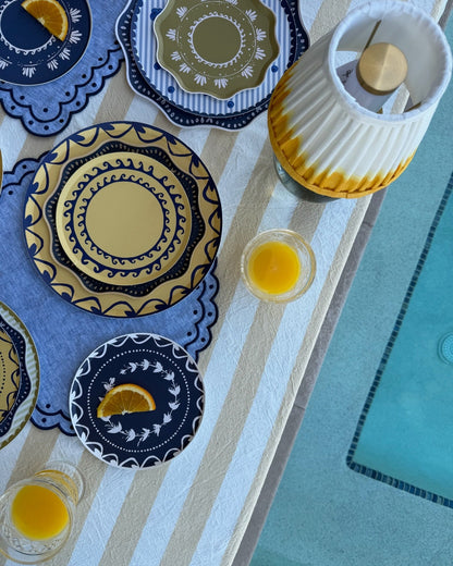 Blue and yellow decorative plates next to a pool
