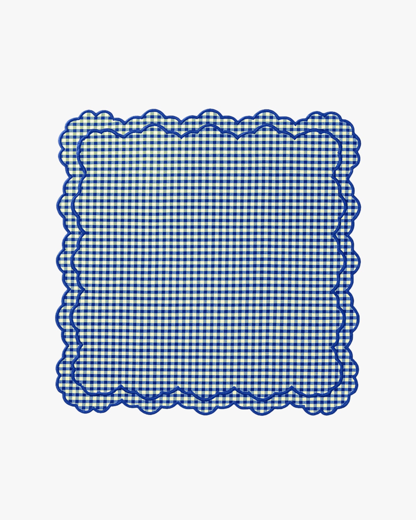 Blue and white checkered doily with scalloped edge on a white background