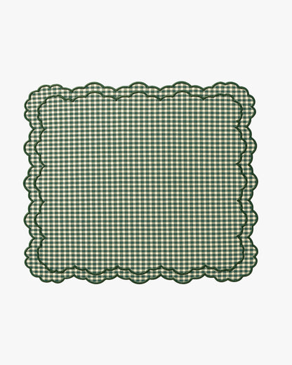 Green checkered placemat with scalloped edge on a white background