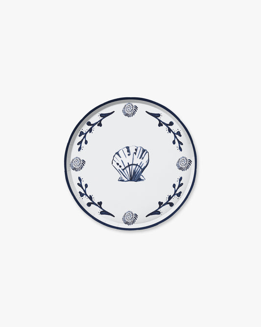 Decorative plate with blue shell design on a white background