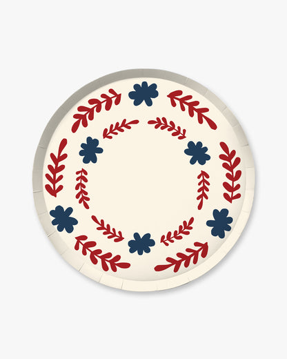 Decorative plate with red and blue floral patterns on a white background