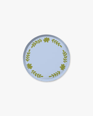 Light blue paper plate with green floral designs around the boarder