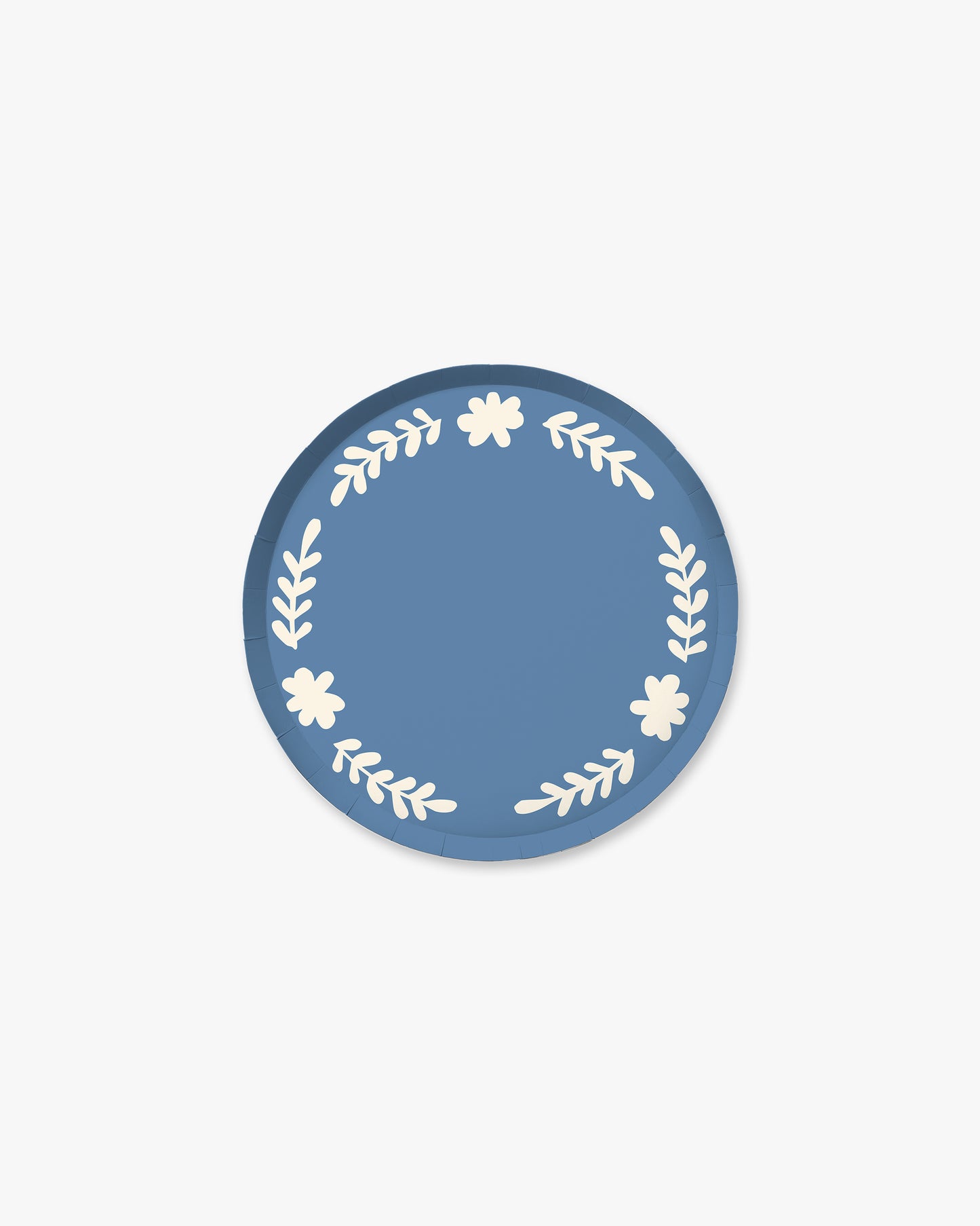 Blue paper plate with white floral designs