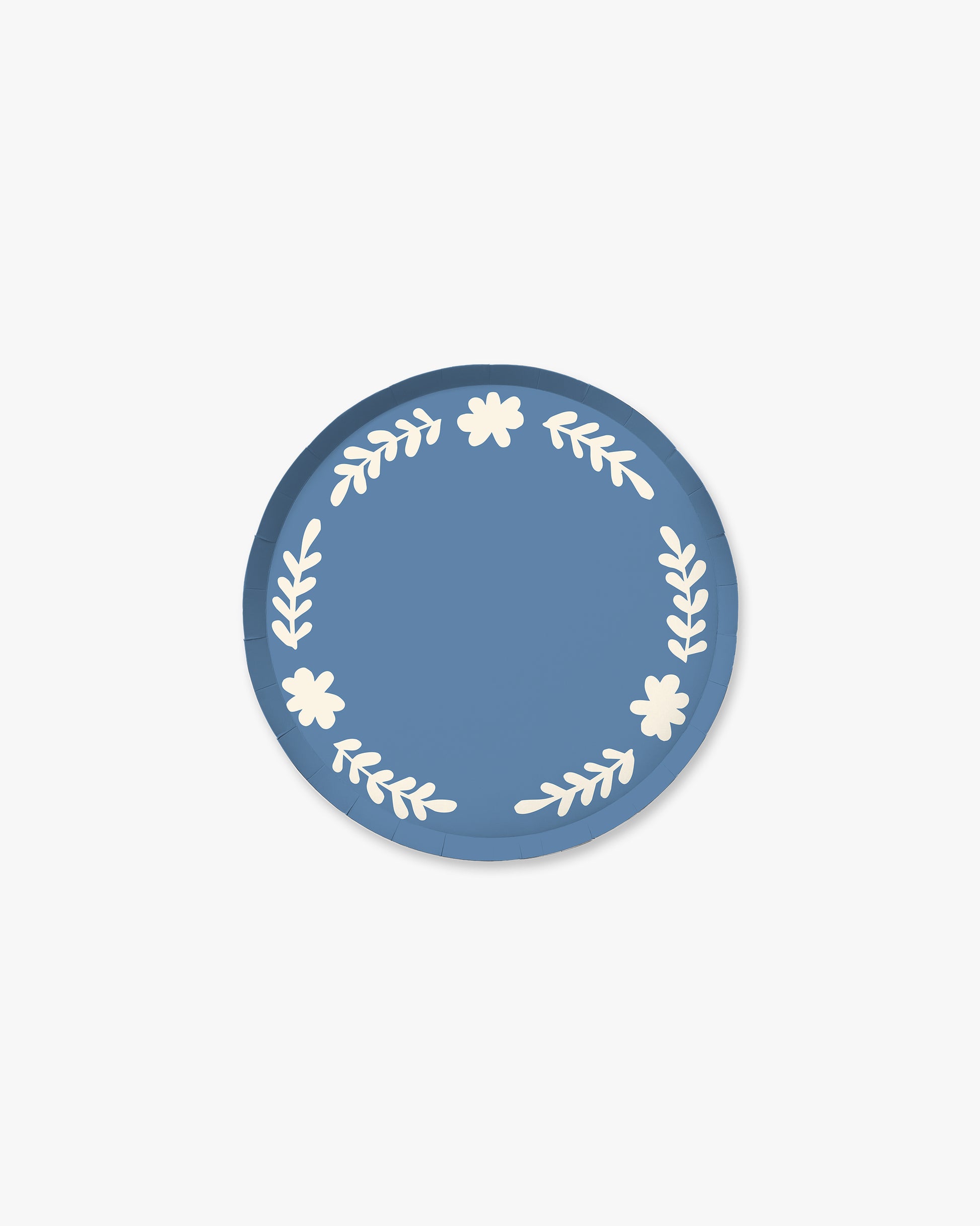 Blue paper plate with white floral designs