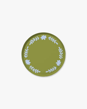 Green round paper plate with light blue floral designs