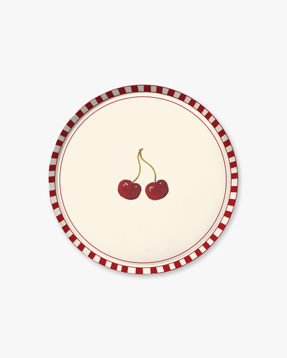 Round plate with red cherries design on a white background