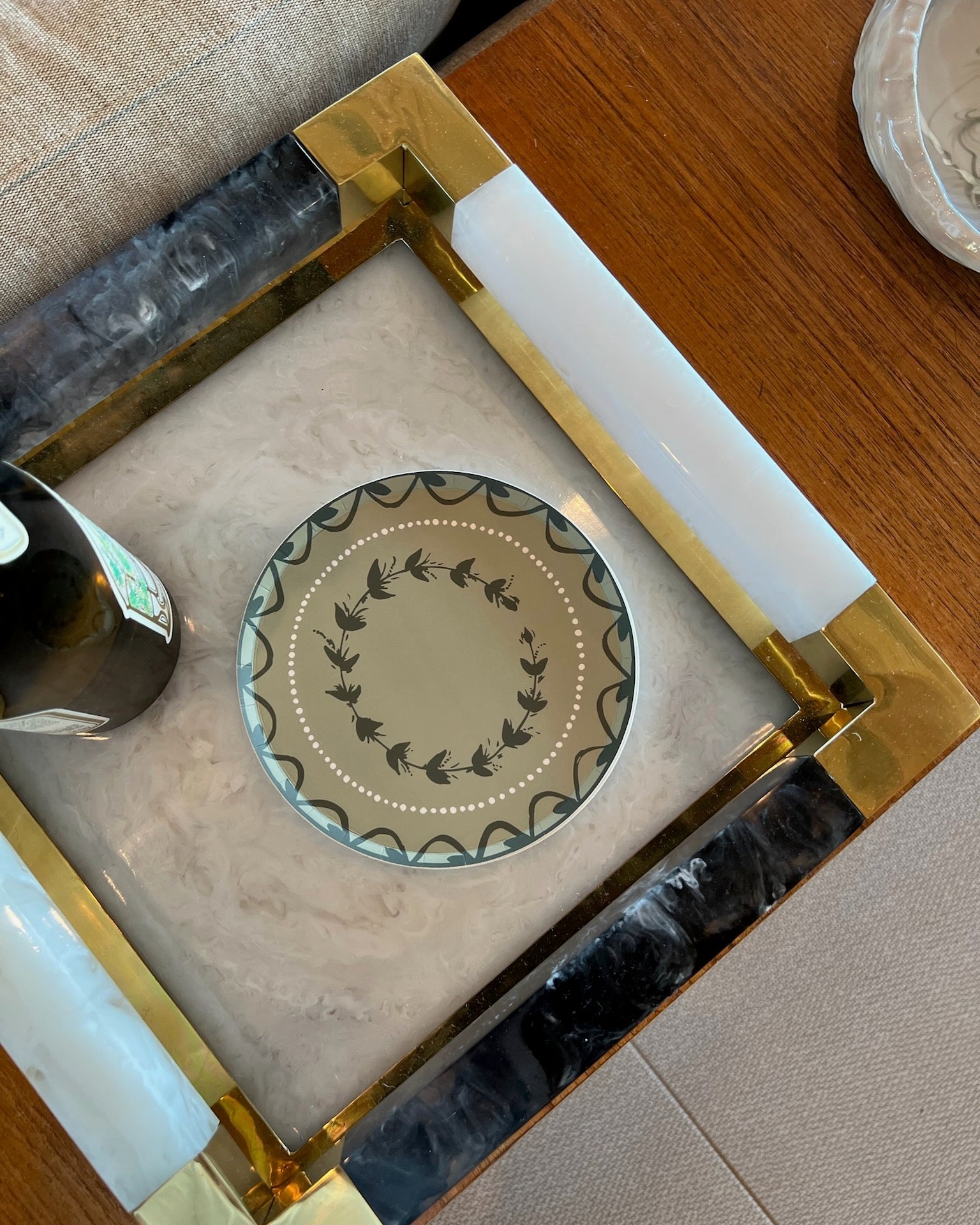 Decorative green plate on a marble tray