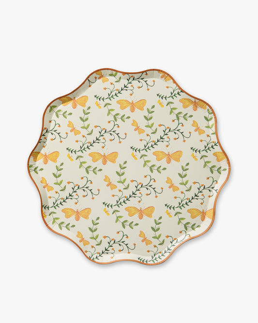 Decorative plate with butterfly and leaf pattern on a white background