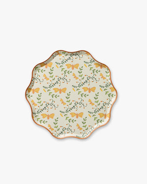 Decorative plate with butterfly and floral pattern on a white background