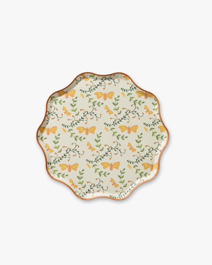 Decorative plate with butterfly and floral pattern on a white background