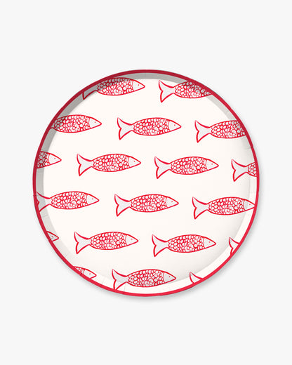 Round plate with red fish pattern on a white background