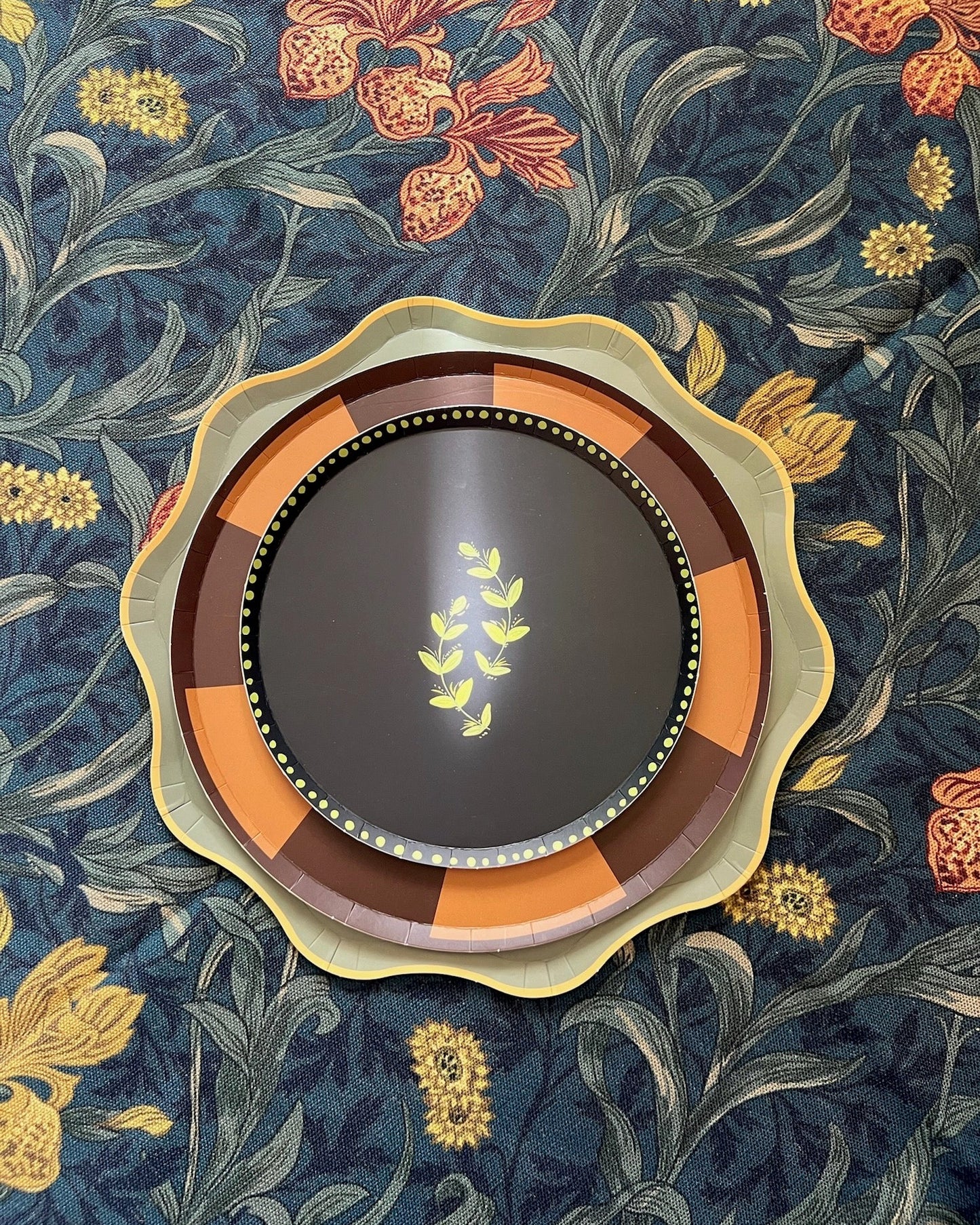 Decorative plate with floral patterns on a dark blue background