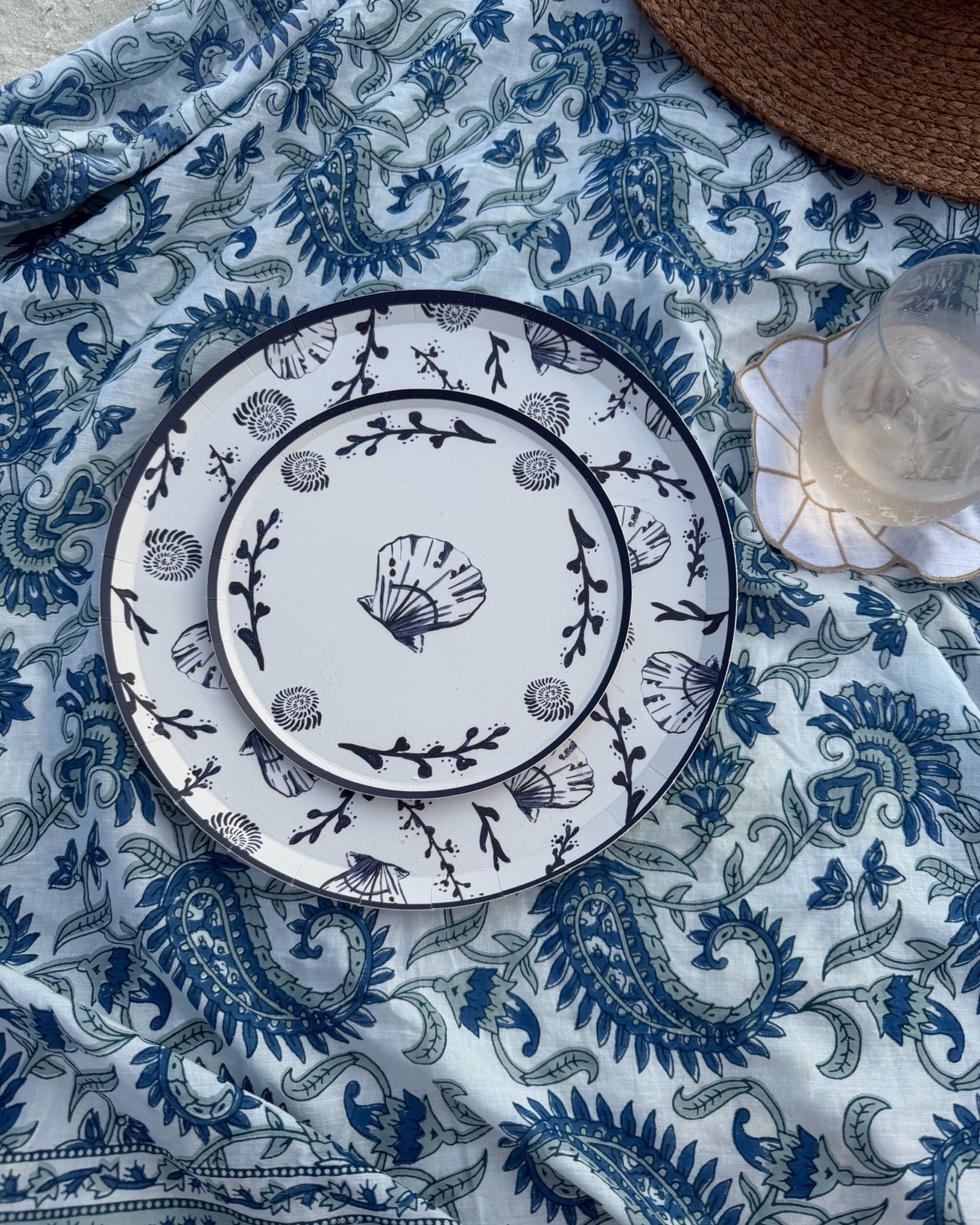 Decorative plates on a blue patterned blanket
