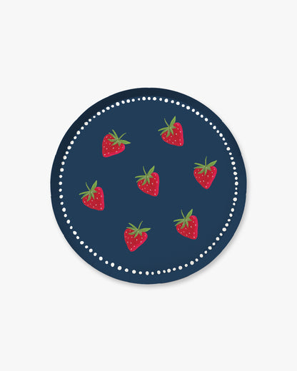 A navy plate with a strawberry pattern
