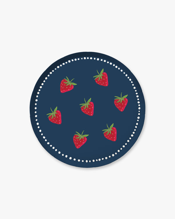 A navy plate with a strawberry pattern