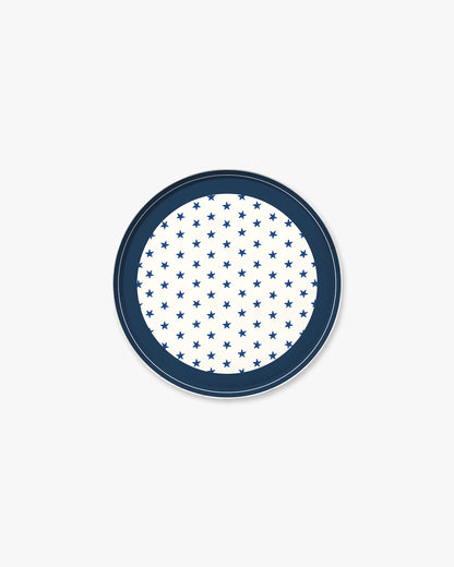 Round blue plate with white star pattern on a white background