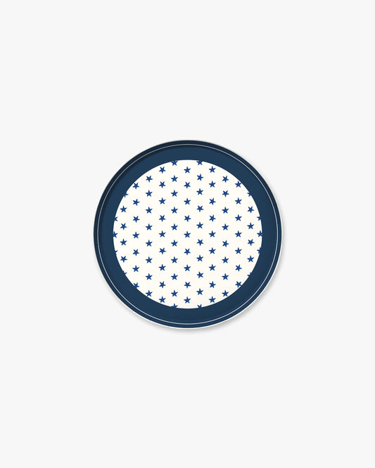 Round blue plate with white star pattern on a white background