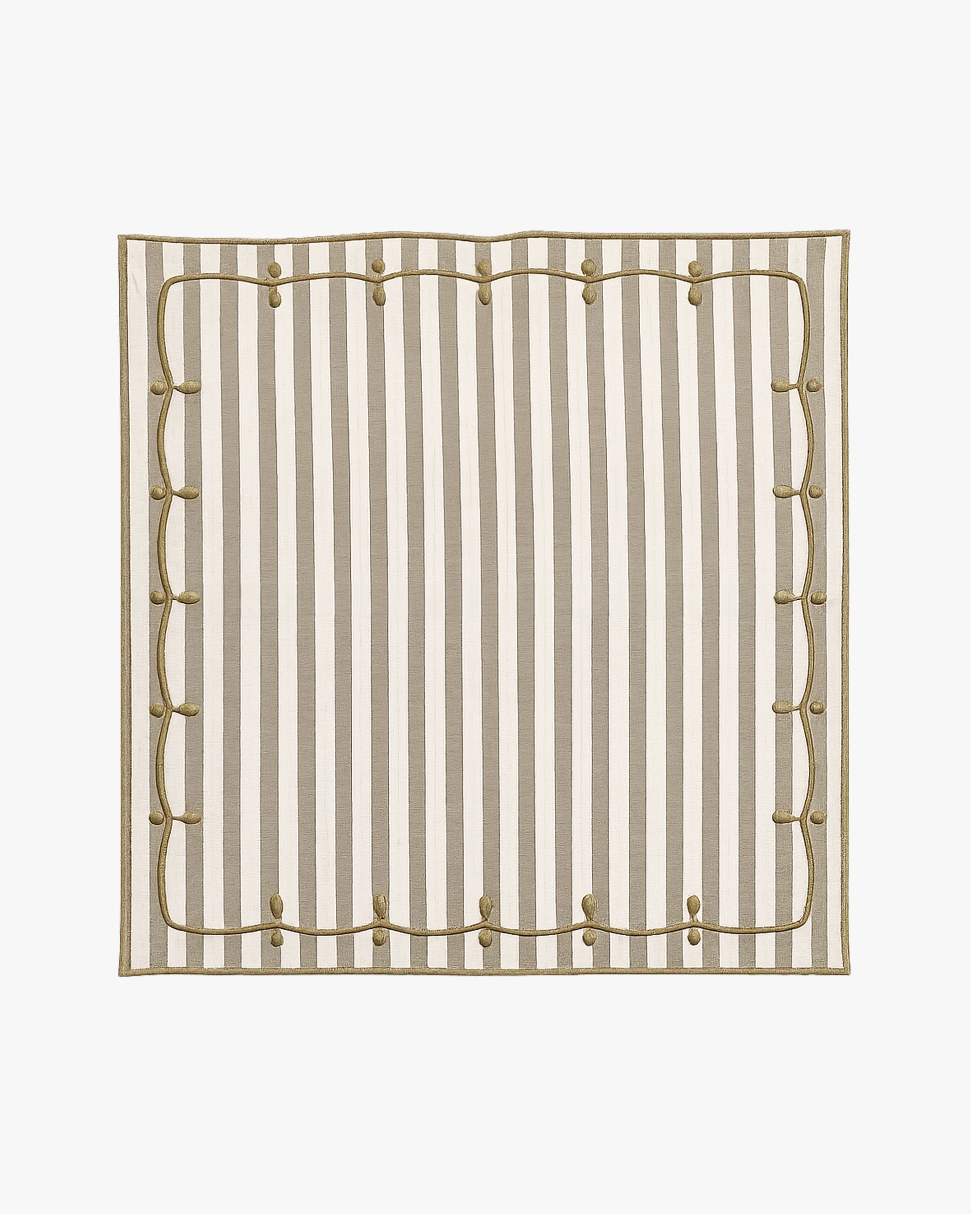 green and white striped napkin with embroidery detail
