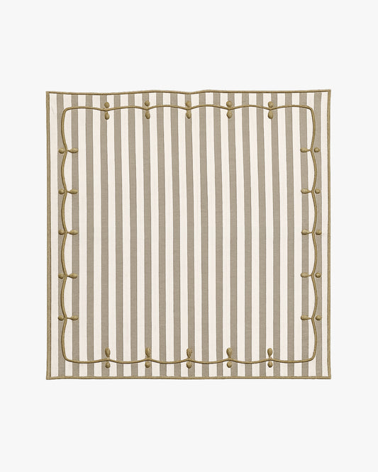green and white striped napkin with embroidery detail
