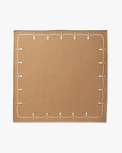 Brown placemat with a detailed white boarder