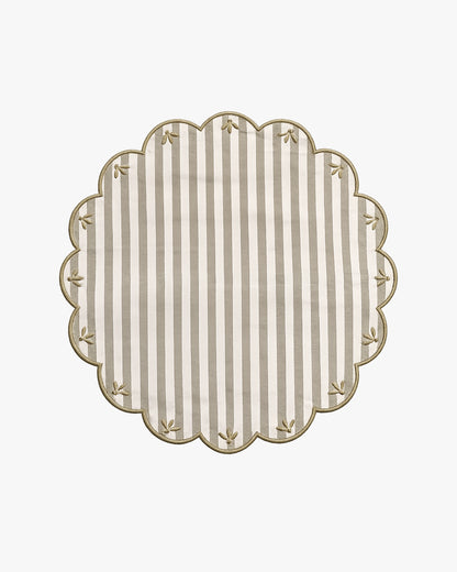 a green and white striped placemat with embroidery