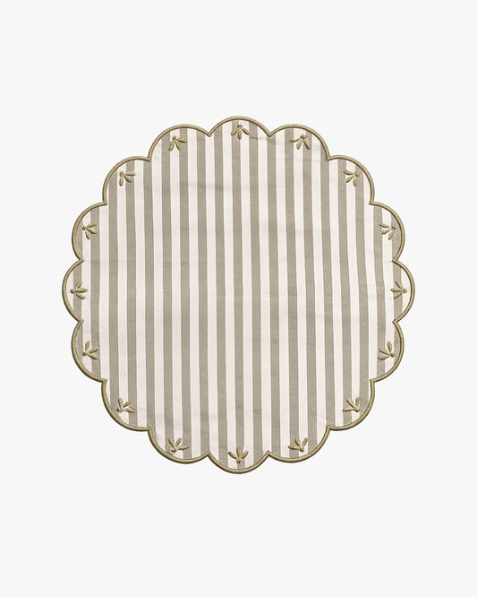a green and white striped placemat with embroidery