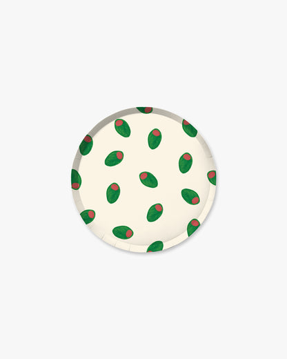 Round white coaster with green and red pattern on a white background
