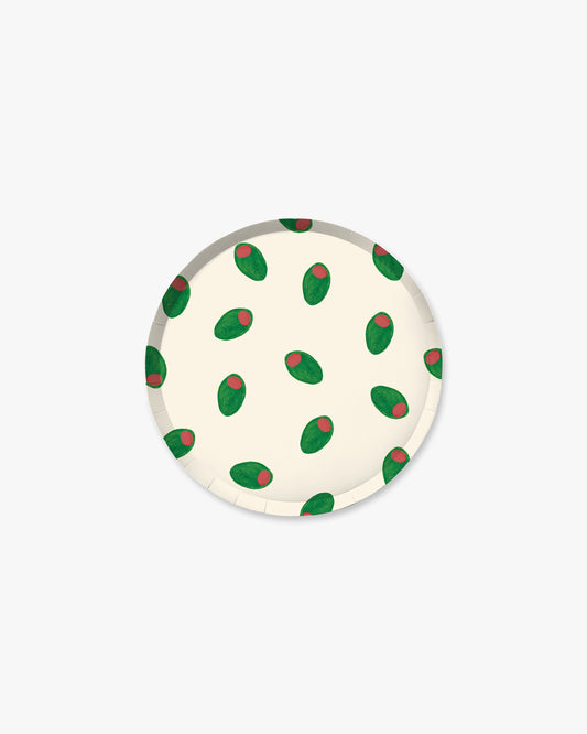 Round white coaster with green and red pattern on a white background