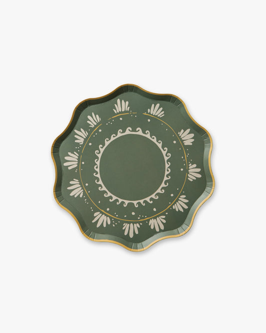 Decorative green plate with gold and white patterns on a white background